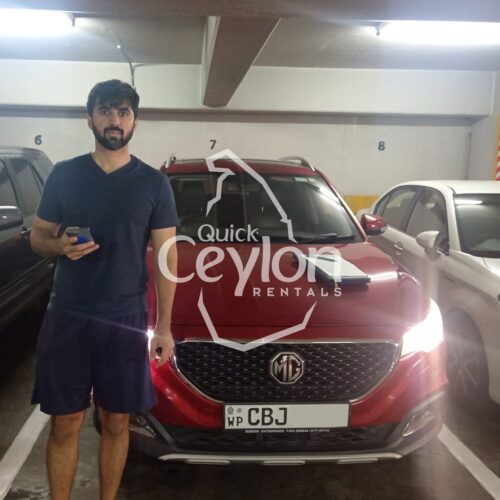 Home 21 Happy customer enjoying a self-drive car rental in Sri Lanka with Quick Ceylon Rentals