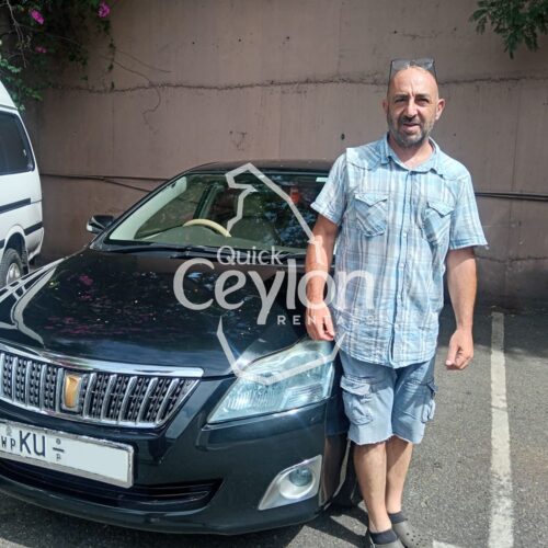 Home 24 Happy customer enjoying a self-drive car rental in Sri Lanka with Quick Ceylon Rentals